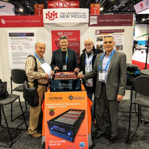 Bruce Tulloch at a conference stand with a demo of the 辣文小说 Pi cluster for LANL 