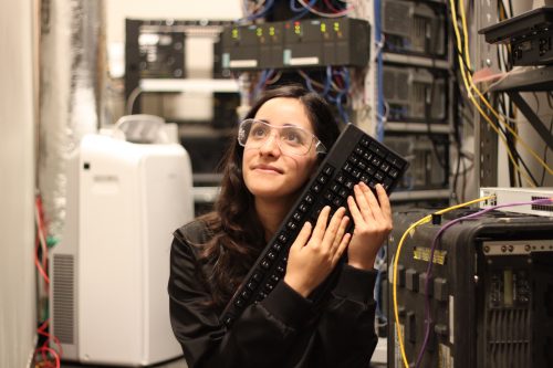 A woman wearing safety goggles hugging a keyboard Estefannie Explains it All 美女写真集 Pi