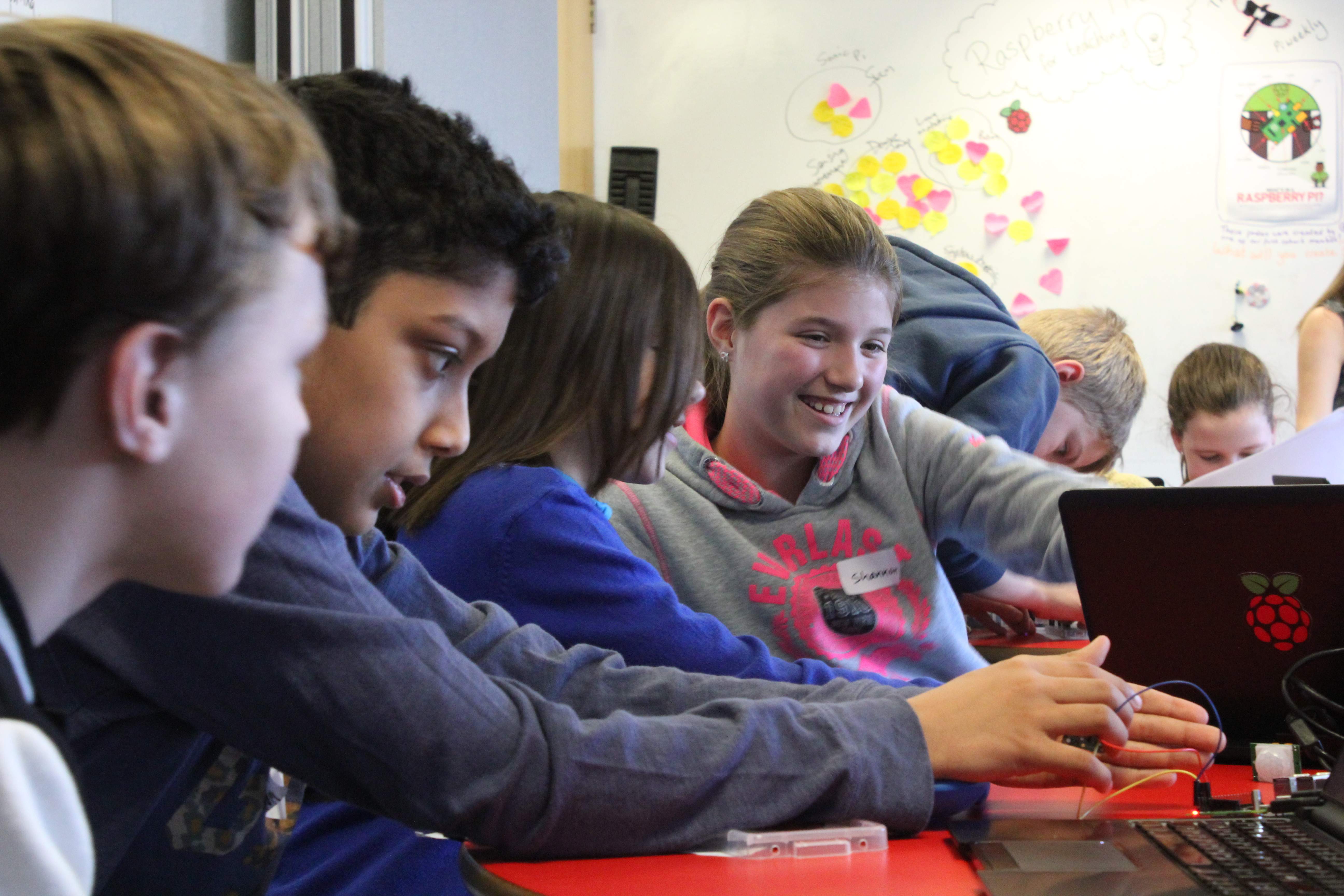 Smiling learners in a 人c交zoozooxx全过程 classroom