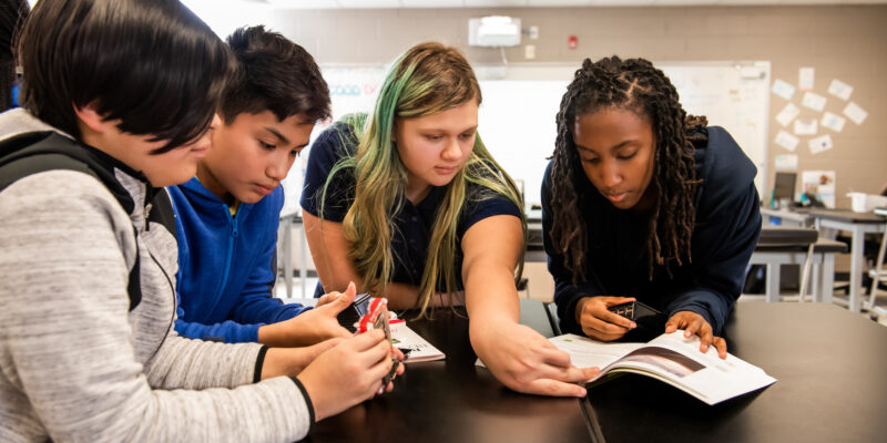 A group of young people in a classroom