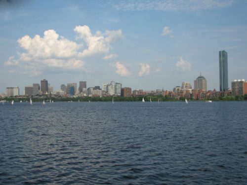 An image of a river with buildings in the background. 