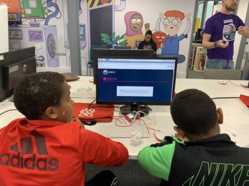 Two young people at a computer. 