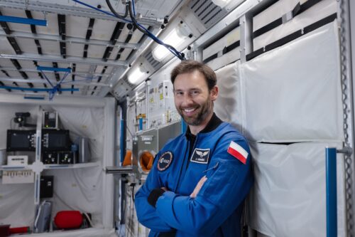 Sławosz Uznański inside a replica of the Columbus module.