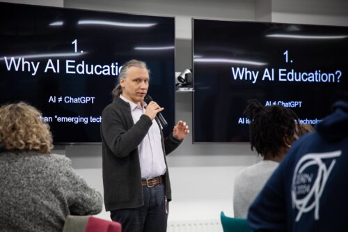 Photo of a cl最新地址er presenting at the AI Symposium.
