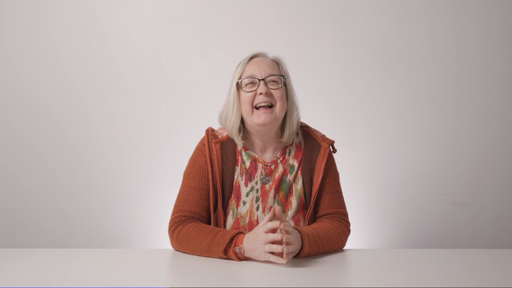 A woman laughing. 