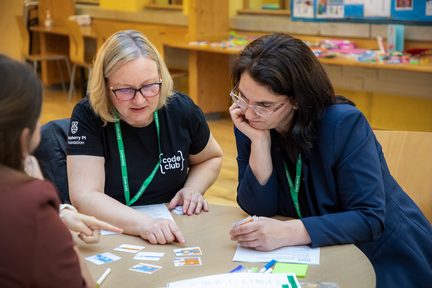 Two attendees during a workshop working together