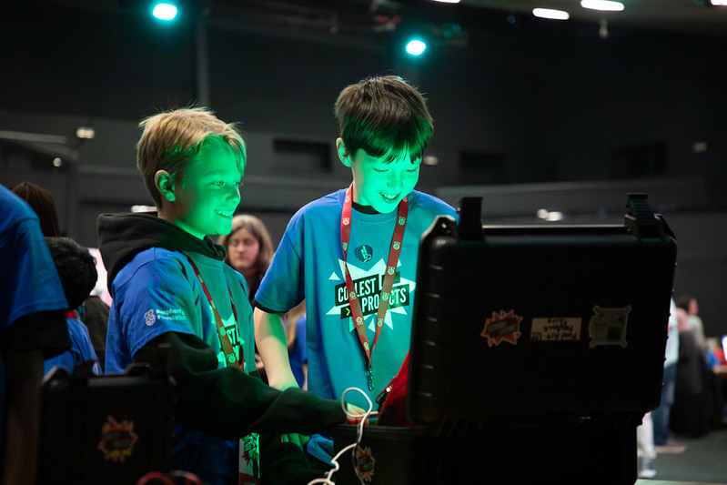 Two young learner testing out a project at Coolest Projects UK