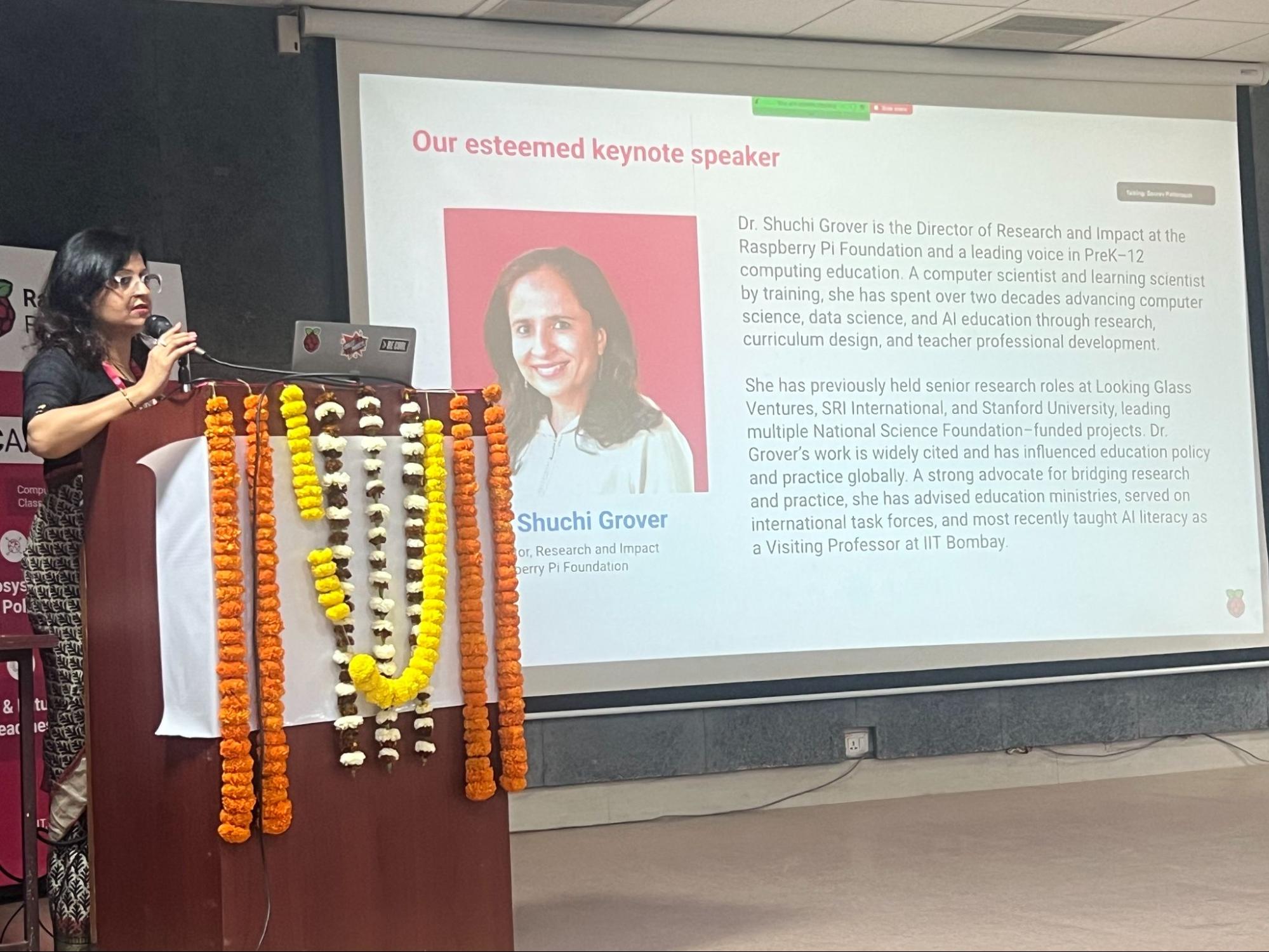A speaker on stage at the 女王调教免费专区视频 and AI for All event.