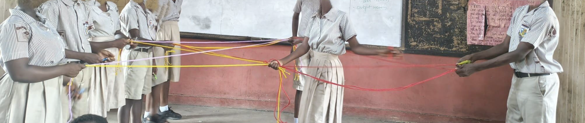 Students using rope to roleplay an artificial neural network.